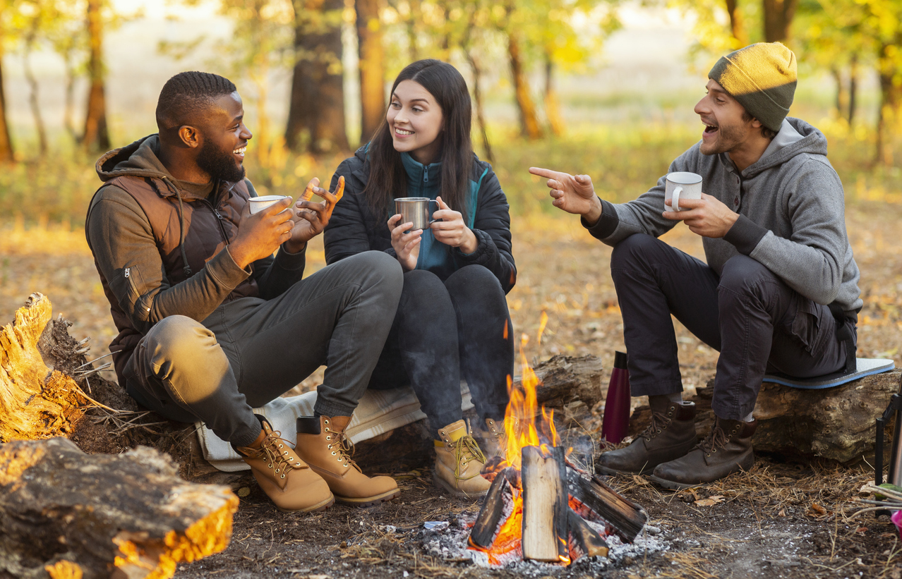 Friends camping together in the fall.